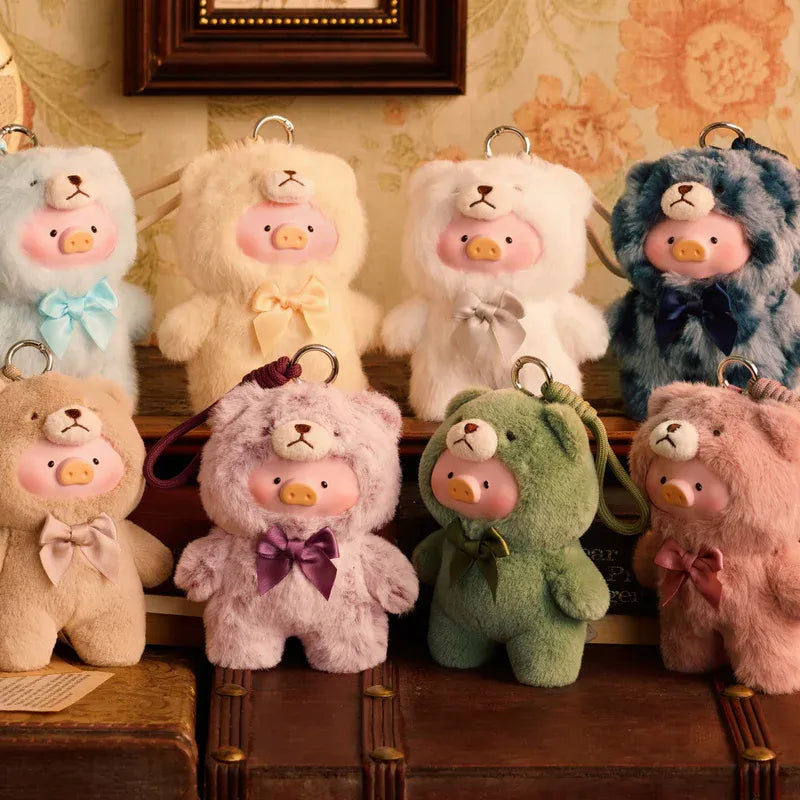 Collection of colorful teddy bear keychains on a wooden shelf with floral wallpaper.