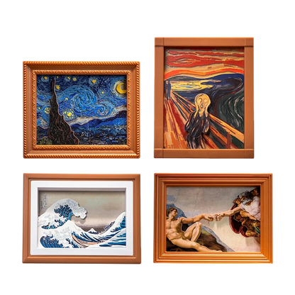 Four famous artworks in wooden frames on a white background